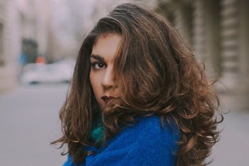 Focus Photo of Woman in Blue Top