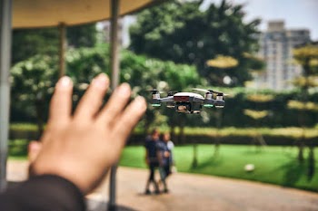Focus Photography of Drone Flying