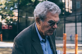 Focus Photography of Man Wearing Silver-colored Framed Eyeglasses