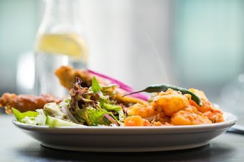 focus photography of vegetable and fruit dish on white ceramic plate