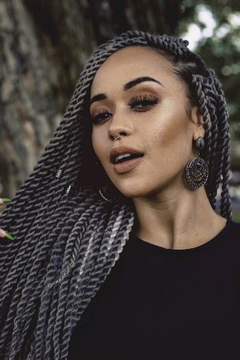 Focus Photography Of Woman In Black Crew-neck Top