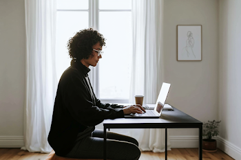 Focused Young Professional Woman in Home Office