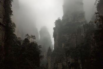 fog-covered mountains during cloudy day