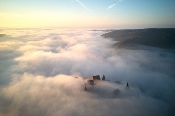 foggy castle near mountain