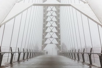 Foggy Walk On Bridge