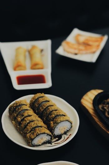 Food Photography of Plate of Sushi Roll