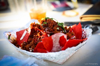 Food Photography of Shredded Flakes and Red Chips Top With Parsley