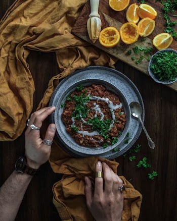 food with white sauce in gray bowl