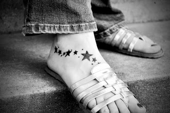 Foot on Grey Strap Sandals
