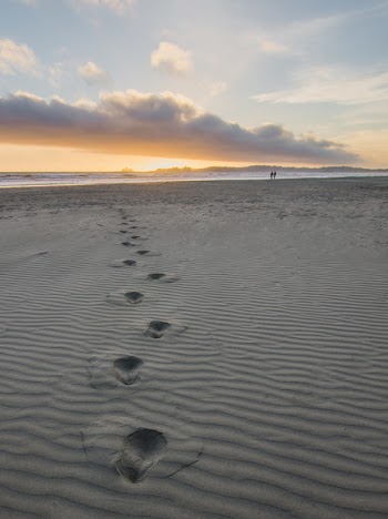 Foot Prints in Gray Sand