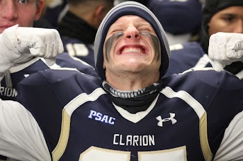 Football Player Making Face in Crowd