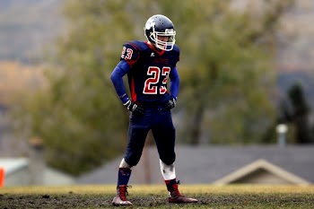 Football Player Wearing No. 23 Jersey Standing on Field