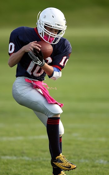 Football Playing Holding Football Selective-focus Photography