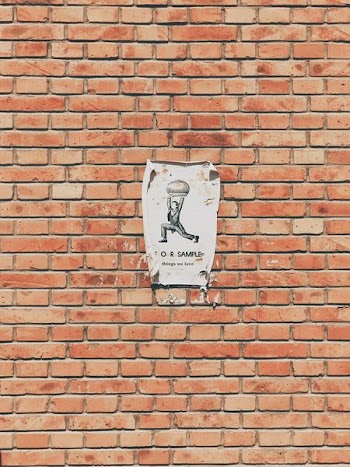 For sample flyer on brown brick wall