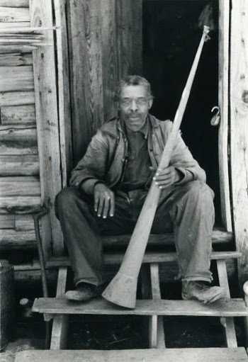 Former slave with horn with which slaves were called; Near Marshall, Texas