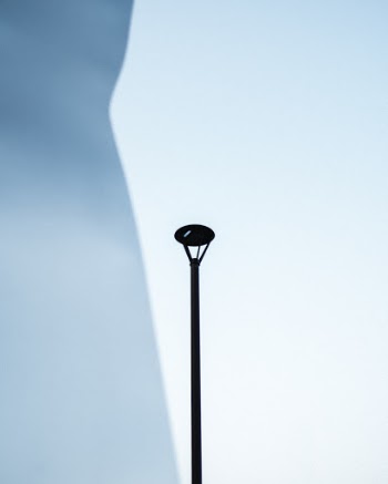 Found this interesting sculpture that perfectly reflected the sky and opened up a way to see this street lamp across the street.