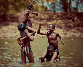 Four Boys Horse Back Riding on River