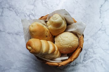 Four Brown Pastries in Brown Wicker Basket
