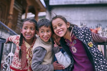 Four children posing for a photo
