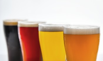 Four Clear Drinking Glasses With Assorted-flavor Beverages