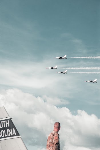 Four Fighting Jets Flying on the Sky