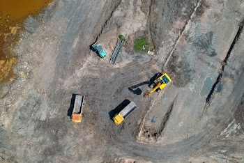 Four Heavy Equipment Trucks