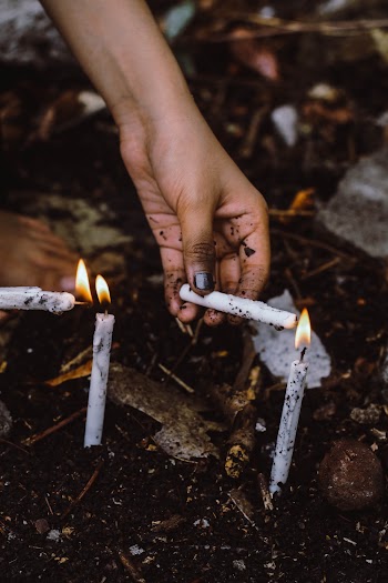Four Lit White Candles