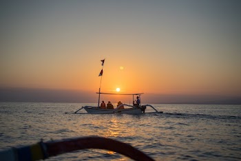Four Men in Boat during Golden Hour