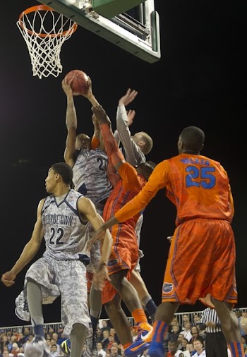Four Men Playing Basketball