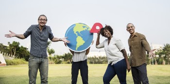 Four People Taking Pose Outdoors