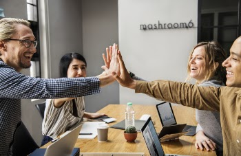 Four People Touching Hands