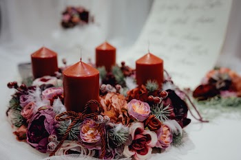 Four Red Pillar Candles on White Surface