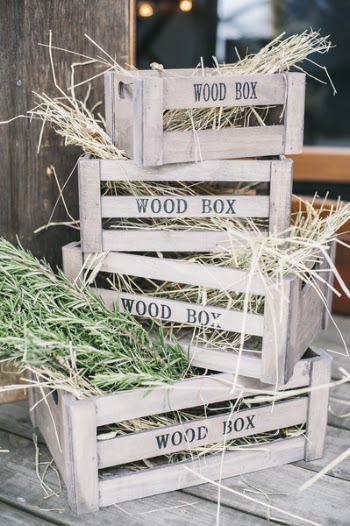 Four Stacks of Brown Wooden Crates With Hays