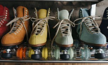 Four Unpaired Assorted Color Roller Skates