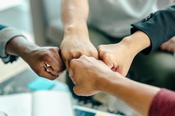 Four Way Fist Bump At Work