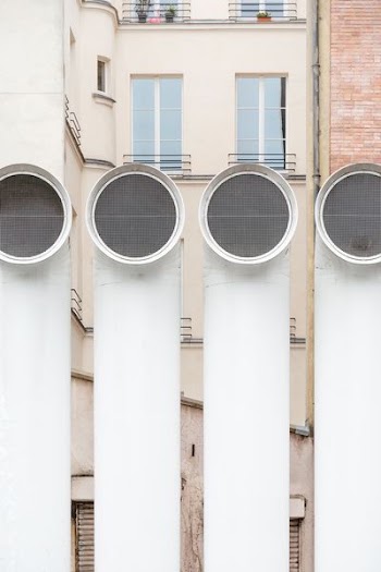 four white exhaust pipes during daytime