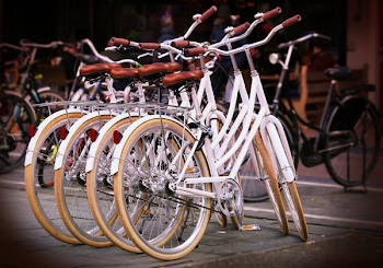Four White Step-through Bicycles