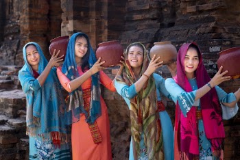 Four Women Holding Clay Pots