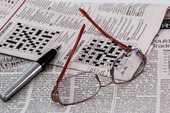 Frame Less Eyeglasses on Newspaper