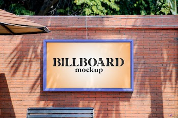 Free Billboard on Brick Wall Mockup