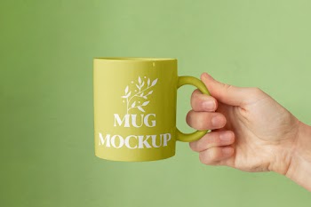 Free Ceramic Mug in Hand Mockup