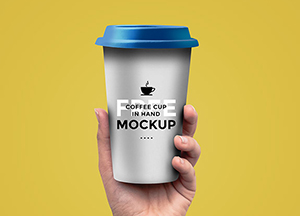 Free Coffee Cup In Hand Mockup coffee cup in hand ckup 