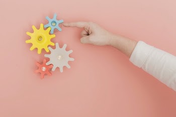 Free finger turning toy gears | Free Photo - rawpixel