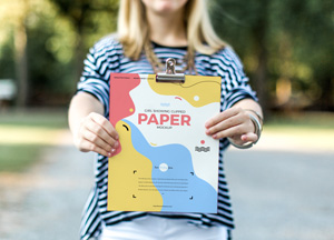 Free Girl Showing Clipped Paper Mockup per paper 