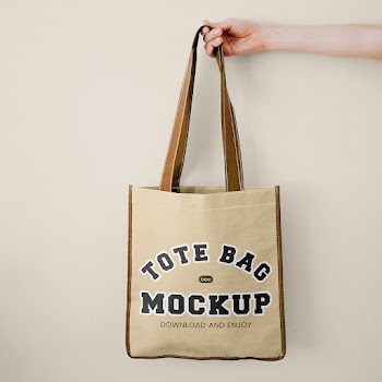 Free Hand Holding Tote Bag Mockup