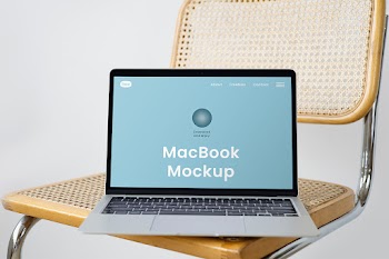 Free MacBook on Chair Mockup