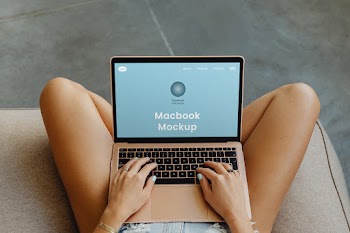 Free MacBook on Legs Mockup