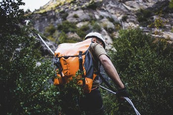 Free man hiking up a mountain | Free Photo - rawpixel