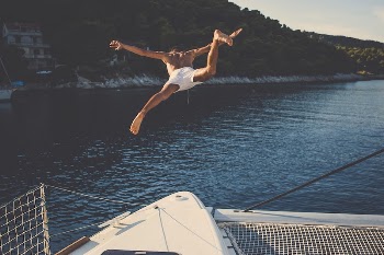 Free man jumping into the sea | Free Photo - rawpixel