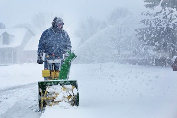 Free man shoveling snow with machine | Free Photo - rawpixel
